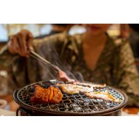 Korean cooking class Vienna - woman grilling meat